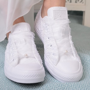 Elegant and chic, these personalized low top tennis shoes feature exquisite Dubai lace detailing. Luxury White Wedding Converse for the stylish bride. Perfect for adding a touch of sophistication to your bridal ensemble. Lace Converse Bridal
