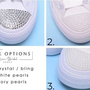 May include: Three close-up images of white canvas shoes with different toe embellishments. The first image shows a shoe with crystal rhinestones. The second image shows a shoe with white pearls. The third image shows a shoe with ivory pearls. The text "TOE OPTIONS" is displayed above the images.