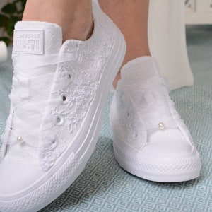 Elegant lace-adorned white Converse for the stylish bride. Customizable low-top tennis shoes featuring exquisite Dubai lace, perfect for a luxurious wedding ensemble