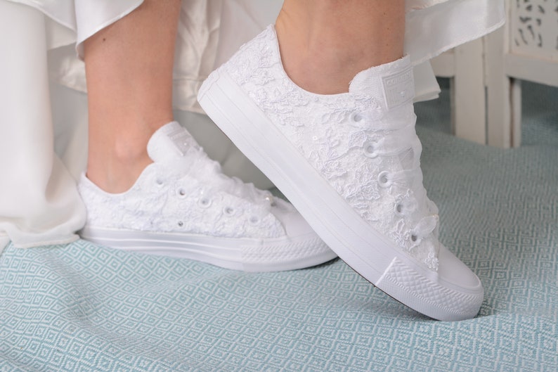 Elevate your bridal style with Luxury Ivory Wedding Converse Lace Low Top. Custom Converse shoes for the bride, personalized with Dubai lace, offering a perfect blend of elegance and comfort.