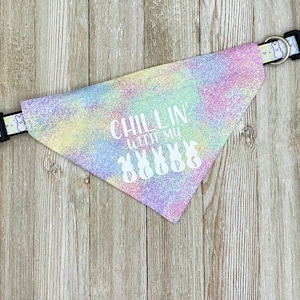 May include: A pastel tie-dye dog bandana with the text "Chillin' with my peeps" and a row of white bunny silhouettes.