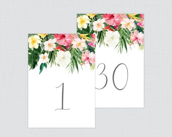 May include: Two white table number cards with tropical floral designs. The numbers 1 and 30 are printed in gray on the cards.