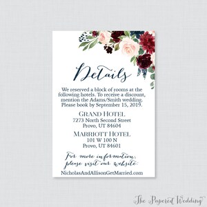 May include: Wedding details card with a floral design in shades of burgundy, pink, and green. The card includes the text "Details" and lists two hotels with addresses and contact information. The text "For more information, please visit our website: NicholasAndAllisonGetMarried.com" is also included.