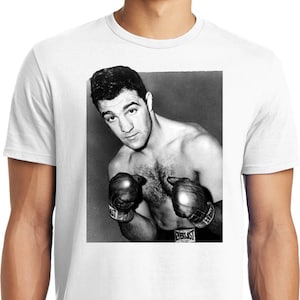 May include: Black and white photo of a boxer wearing boxing gloves. The boxer is wearing a black waistband with the word "Everlast" printed on it.