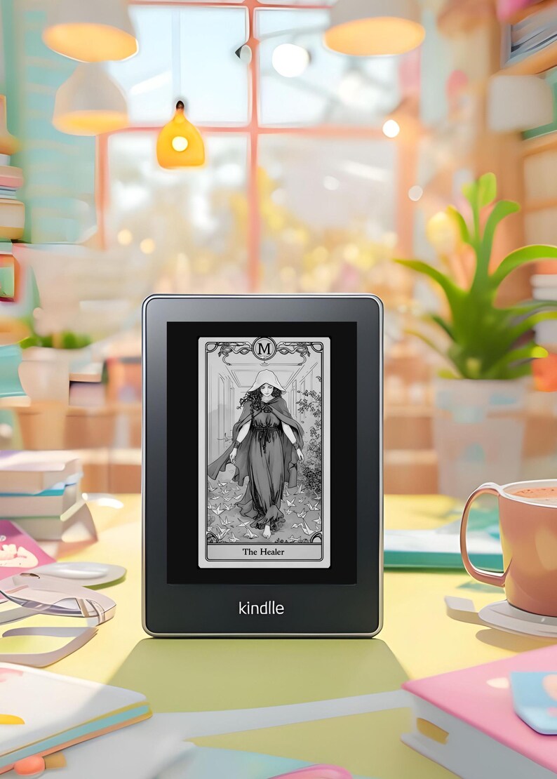 May include: A black and white illustration of a woman in a long robe with a hood, walking on a path with white paper birds. The image is displayed on a Kindle e-reader, which is sitting on a yellow surface. The text on the card reads "The Healer".