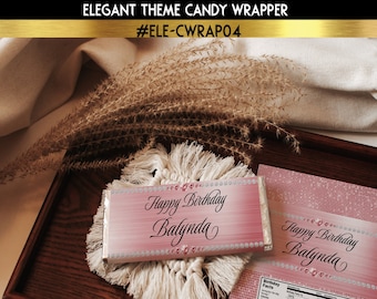 May include: Pink and white candy bar wrapper with a glittery design and the text "Happy Birthday Balynda".