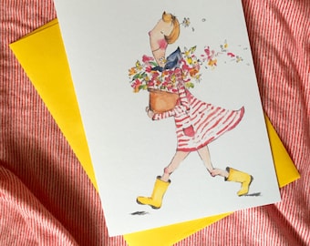 May include: Watercolor illustration of a person carrying a flower pot, wearing a red and white striped dress and yellow boots. The artwork is on a white card with a yellow envelope, set against a red and white striped background.