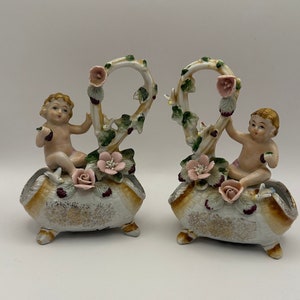 UCAGCO cherub porcelain figurine basket child figural basket hand painted