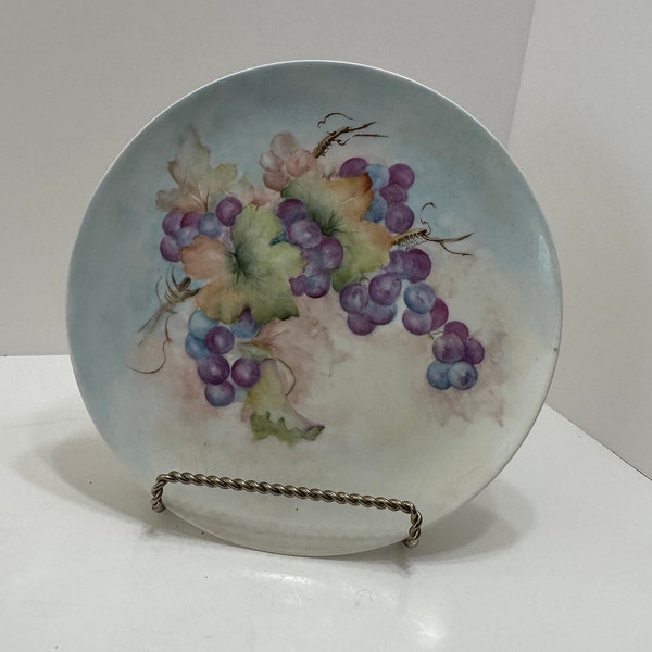 Hand painted decorative plate with purple grapes