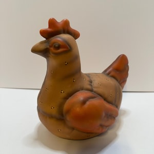 Ceramic brown hen marked K.C. 1986 hand painted
