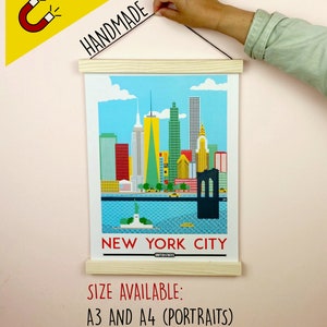 May include: A colorful illustration of the New York City skyline with the Statue of Liberty in the foreground. The print is framed with a wooden hanger and is available in A3 and A4 sizes. The text "NEW YORK CITY" and "UNITED STATES" is printed below the image.