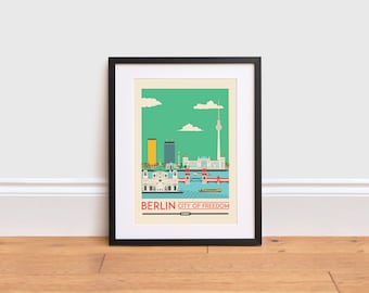 Pode incluir: Uma impressão emoldurada preta com uma ilustração colorida do horizonte de Berlim, incluindo o Portão de Brandemburgo, o Edifício do Reichstag e a Torre de Televisão de Berlim. O texto "BERLIN CITY OF FREEDOM" é impresso abaixo da ilustração.