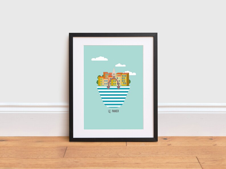 May include: A turquoise and white striped illustration of a city skyline inside a shopping bag with the text "Le Panier" below. The city skyline is made up of yellow and orange buildings with a church steeple.