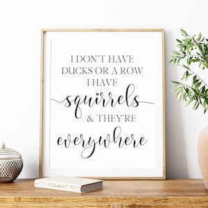 May include: Black and white printable wall art with the text "I don't have ducks or a row I have squirrels & they're everywhere"