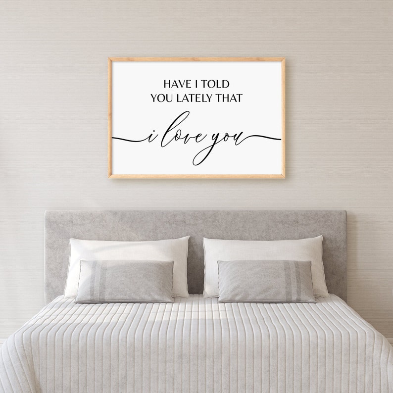 May include: A framed print with the text "Have I told you lately that I love you" in black script font on a white background.