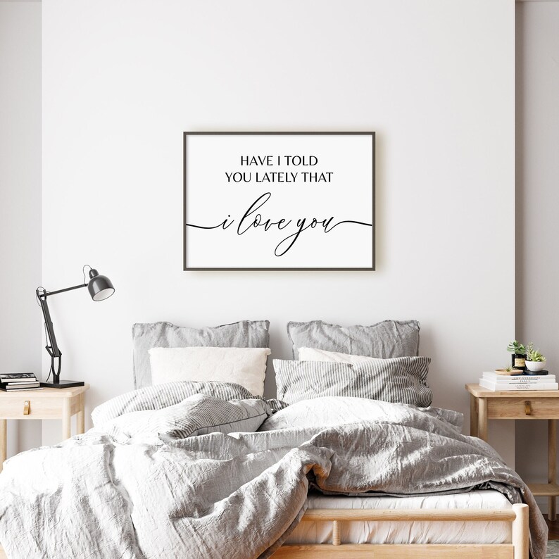 May include: A framed print with the text "Have I told you lately that I love you" in black cursive font on a white background.