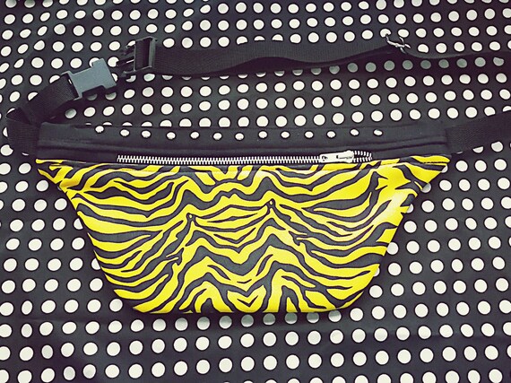 1 Pocket Pocket Metal zipper and rivets. Handcrafted printed yellow zebra fabric