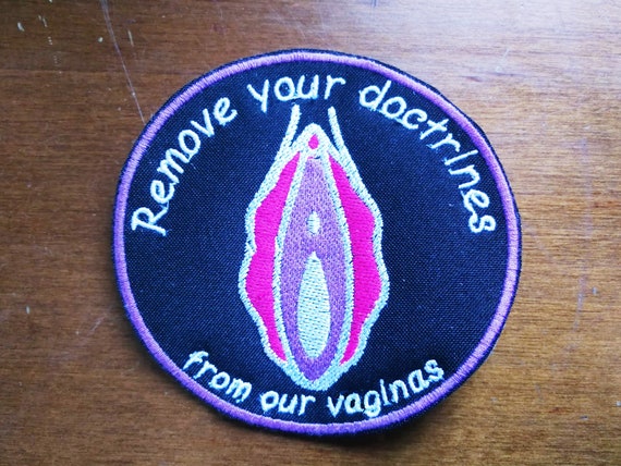 Embroidered patches in yarn Remove Your Doctrines from our model vaginas with white or black fabric