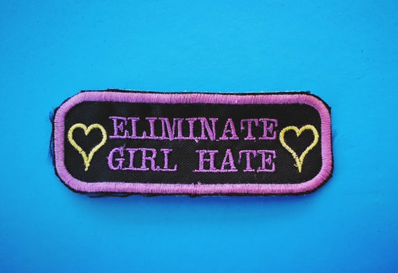 Feminist patch embroidered on thread." Eliminate Girl Hate" Colors Lavender and Lime. 4x10 cm approximately