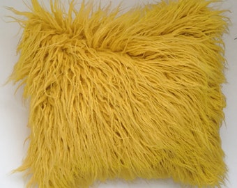 yellow furry pillow
