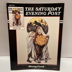 May include: A cross-stitch pattern for "The Saturday Evening Post" magazine cover, featuring a Halloween scene. The image shows two figures in costumes holding a carved pumpkin. The text reads "Halloween Tricks - November 2, 1935."