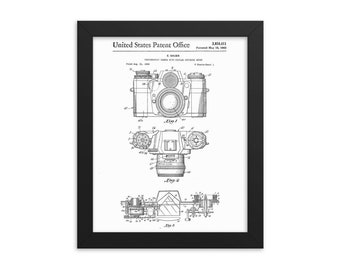 May include: Black and white line drawing of a camera patent. The patent is titled "PHOTOGRAPHIC CAMERA WITH PEOPLE EXPOSURE METER" and the patent number is 3,054,411. The patent was filed on May 18, 1962.