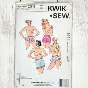 May include: A Kwik Sew pattern envelope, number 2041, for sizes XS-S-M-L-XL. The white envelope features illustrations of four different styles of shorts or bloomers, labeled A, B, and C, with text including the brand name and address.