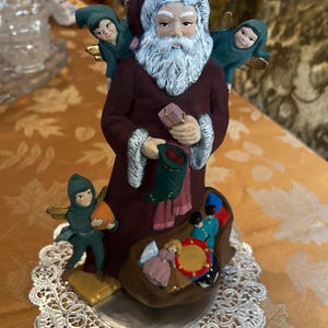 Vintage Hand Painted Santa Figure Surrounded By Winged Fairies & a Toy Sack ~ Classic Ceramic Christmas Decoration