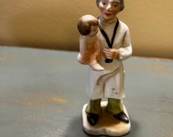 Vintage Hand Painted Porcelain Nurse / Doctor Figure Holding a Baby ~ Hand Painted Japan~ Nice Quality