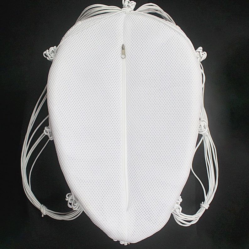 May include: White mesh drawstring bag with a zipper closure. The bag is made of a lightweight, breathable material and has a round shape.