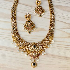 Matte Gold Finish,Haram/Long,White AD,Ruby-Green Kemp Stone Necklace with Dangle Earrings,Bollywood Indian Wedding,Contemporary Jewelry