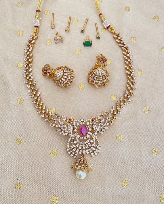 Gold stone necklace set designs discount