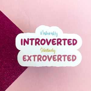 May include: White sticker with a cloud shape. The text "Naturally Introverted Selectively Extroverted" is written in pink, blue, and gold lettering.