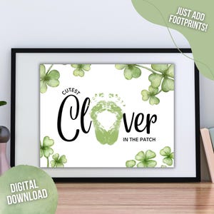 May include: A printable digital download of a baby footprint art design. The design features a green clover with the text "Cutest Clover in the Patch".