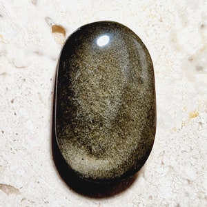 Golden obsidian cabochon