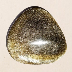 Golden obsidian cabochon