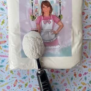 May include: A bag of white powder with a label featuring a woman in a pink apron. An ice cream scoop with a scoop of white ice cream is in front of the bag. The scoop handle is black with the words "ICE CREAM" in white.