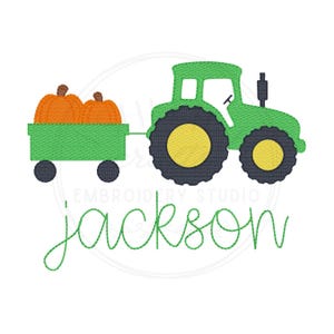 May include: An embroidery design featuring a bright green tractor pulling a green trailer filled with two orange pumpkins. The tractor has dark gray wheels with yellow centers. The name jackson is stitched in green cursive script below the tractor.