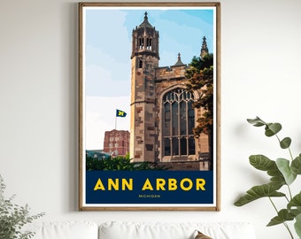 May include: A vintage-style poster with a blue and yellow color scheme featuring a tall brick building with a pointed roof and a large window. The building is set against a blue sky with white clouds. The poster has the text "ANN ARBOR MICHIGAN" in yellow letters on a blue background.
