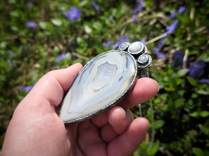 banded montana agate moonstone pendant handmade handcrafted statement piece necklace jewelry white blue translucent gorgeous