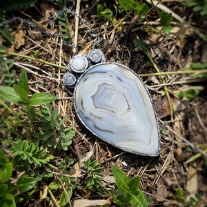 banded montana agate moonstone pendant handmade handcrafted statement piece necklace jewelry white blue translucent gorgeous