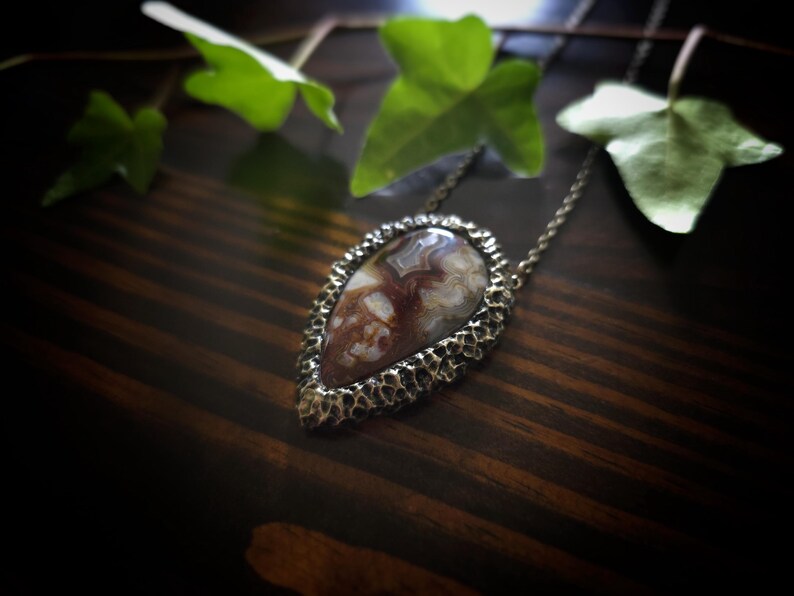 brown mocha earthy tones colors jewelry mexican crazy lace agate necklace pendant gold tone texture organic natural pear shape bronze brass banded agate handmade handcrafted artisan jewelry woman owned gift ideas gift for her