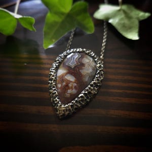 brown mocha earthy tones colors jewelry mexican crazy lace agate necklace pendant gold tone texture organic natural pear shape bronze brass banded agate handmade handcrafted artisan jewelry woman owned gift ideas gift for her