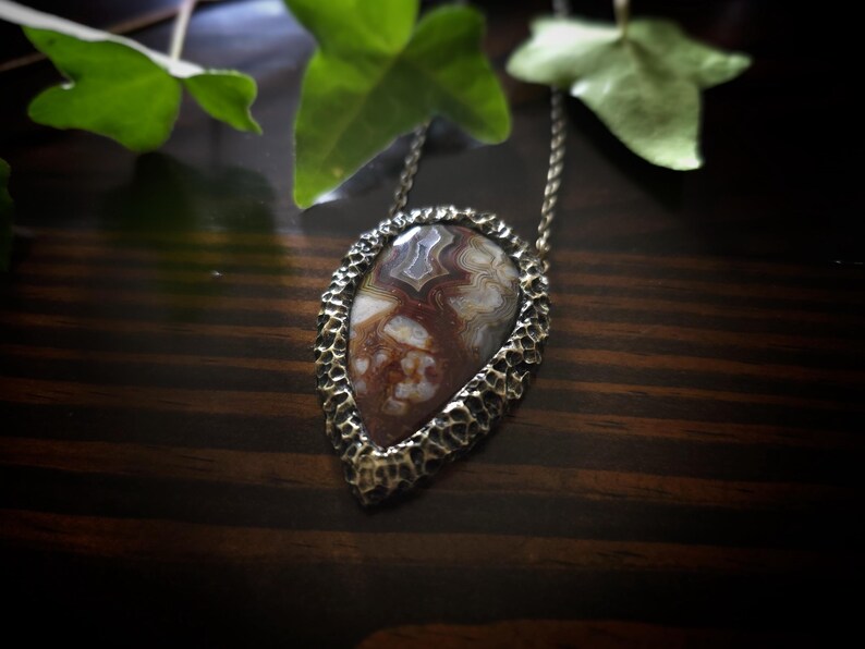 brown mocha earthy tones colors jewelry mexican crazy lace agate necklace pendant gold tone texture organic natural pear shape bronze brass banded agate handmade handcrafted artisan jewelry woman owned gift ideas gift for her