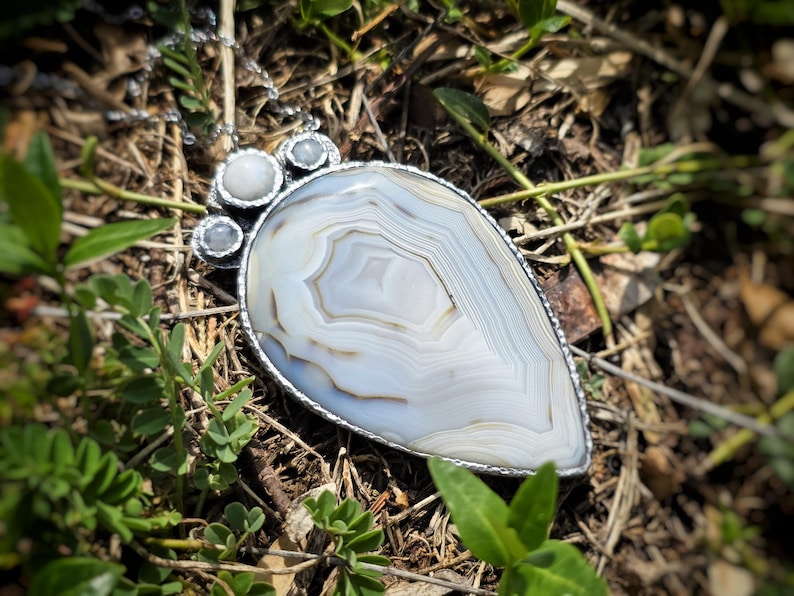 banded montana agate moonstone pendant handmade handcrafted statement piece necklace jewelry white blue translucent gorgeous