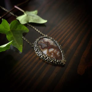brown mocha earthy tones colors jewelry mexican crazy lace agate necklace pendant gold tone texture organic natural pear shape bronze brass banded agate handmade handcrafted artisan jewelry woman owned gift ideas gift for her
