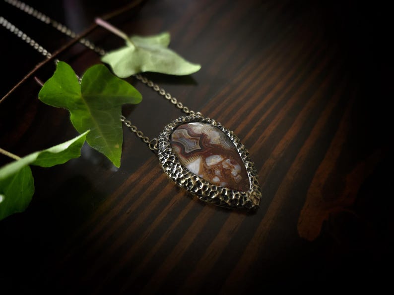 brown mocha earthy tones colors jewelry mexican crazy lace agate necklace pendant gold tone texture organic natural pear shape bronze brass banded agate handmade handcrafted artisan jewelry woman owned gift ideas gift for her