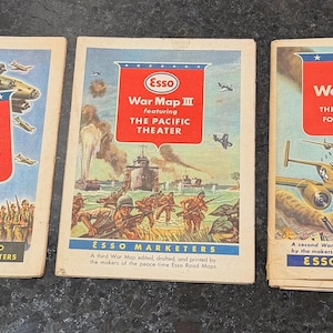 May include: Three vintage Esso War Map booklets featuring illustrations of military aircraft, tanks, and soldiers. The covers are titled War Map, War Map III featuring The Pacific Theater, and War Map II featuring The World Island Fortress Europe.