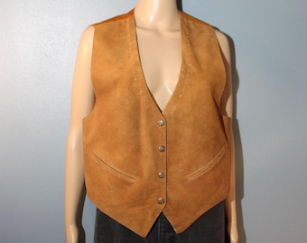 May include: A brown suede waistcoat with a V-neck and button fastening. The waistcoat has two pockets on the front and decorative stitching around the neckline.