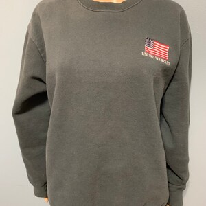 Vintage 1980-1990-talets United We Stand broderad amerikansk flagga blekt svart pullover rund halströja bild 1